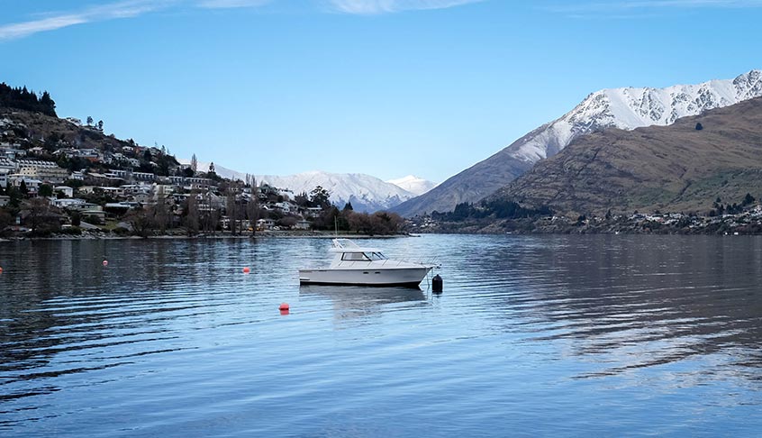 boat sitting in the middle of a lake