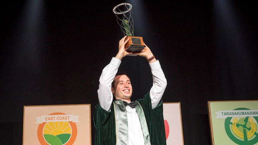 Jake Jarman holding Young Farmer of the Year trophy 