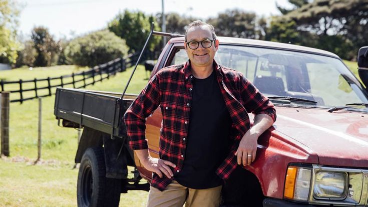 Michael van de Elzen leaning on red ute 