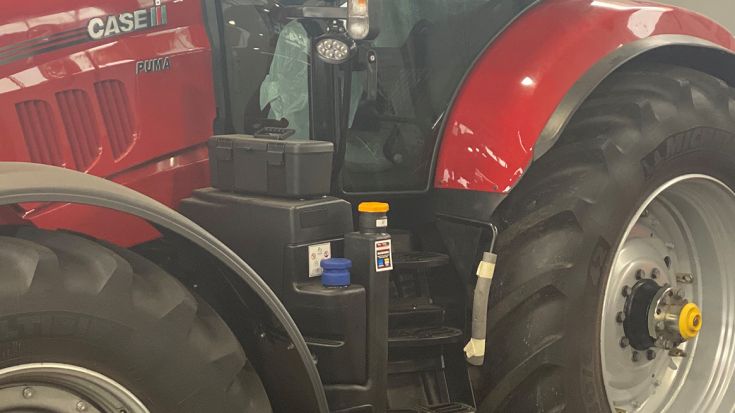 tractor with warning stickers on fuel gauge 