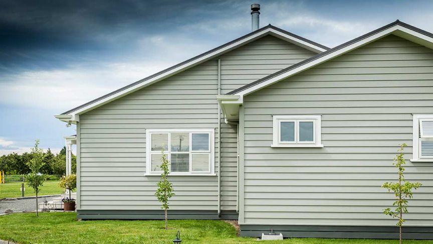 Side view of grey weatherboard house 