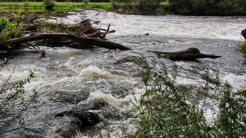 flooded river with floating debris 