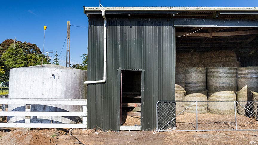 shed with baled hay inside 