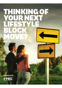 Couple standing at crossroads looking at sign that points in opposite directions 