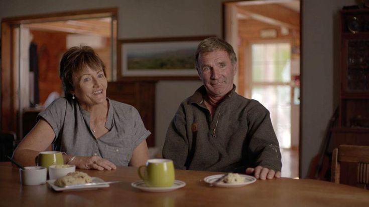 Murray and Bev Bell sitting at dining table with cups of tea 