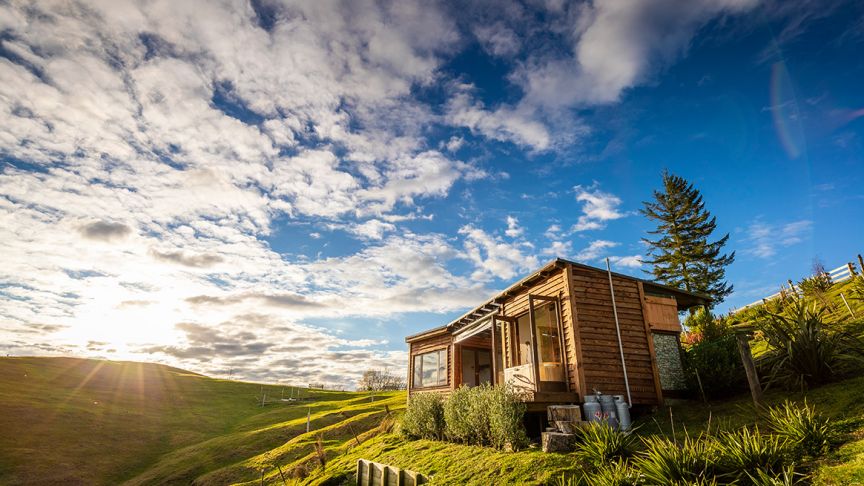 Wooden cabin on hillside 